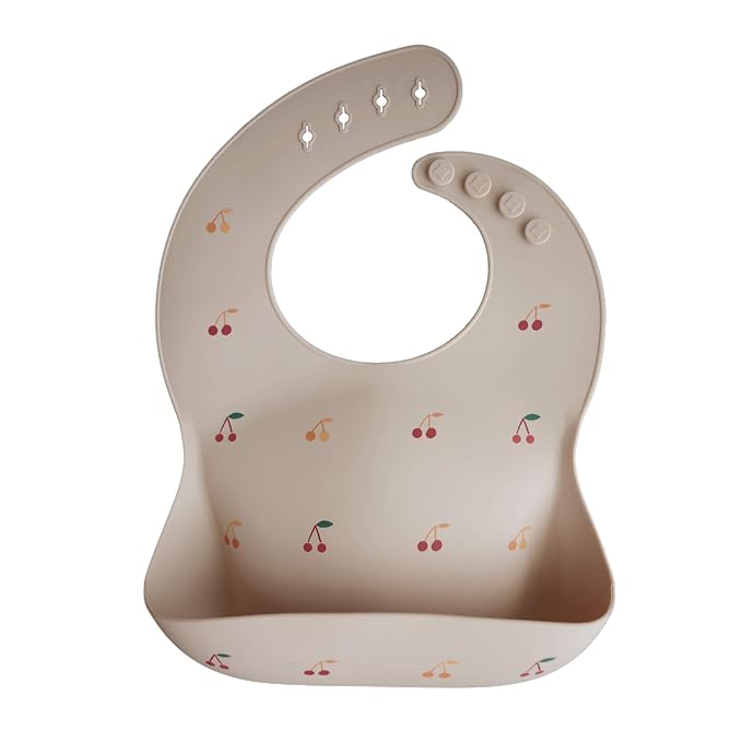 mushie Silicone Baby Bib | Adjustable Fit Waterproof Bibs (Cherries)