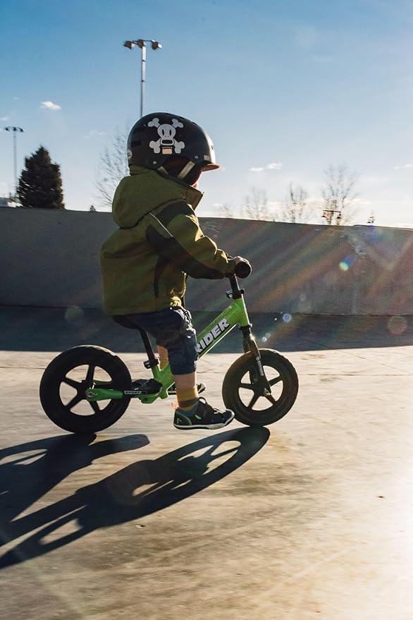 Strider 12” Sport Bike - No Pedal Balance Bicycle for Kids 1 to 4 Years - Includes Safety Pad, Padded Seat, Mini Grips & Flat-Free Tires - Tool-Free Assembly & Adjustments