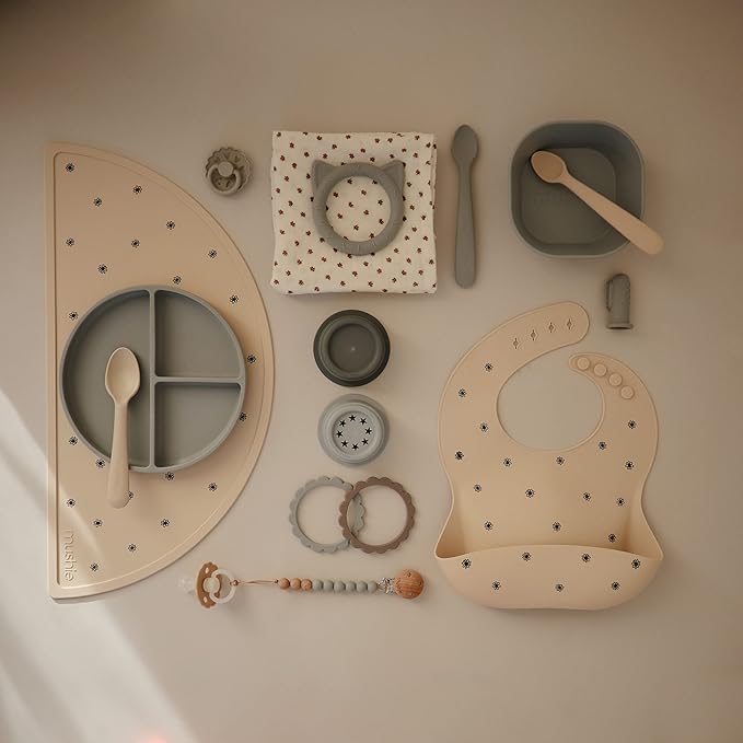 mushie Silicone Baby Bib | Adjustable Fit Waterproof Bibs (Black Daisy)