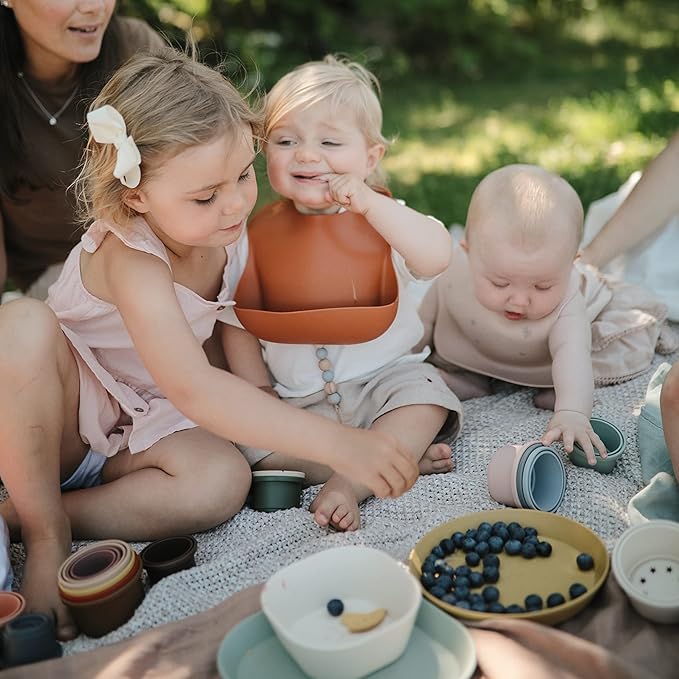 mushie Silicone Baby Bib | Adjustable Fit Waterproof Bibs (Powder Pink Confetti)