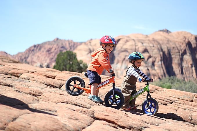 Strider 12” Sport Bike - No Pedal Balance Bicycle for Kids 1 to 4 Years - Includes Safety Pad, Padded Seat, Mini Grips & Flat-Free Tires - Tool-Free Assembly & Adjustments